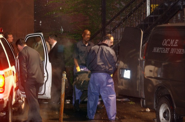 FILE - The body of Jason Mizell, a.k.a. Jam Master Jay, a member of the pioneering rap trio Run DMC, is removed from a recording studio where he was shot and killed, Wednesday, Oct. 30, 2002 in the Queens borough of New York. Opening statements are set for Monday in the federal murder trial of Karl Jordan Jr. and Ronald Washington, who were arrested in 2020 for the murder of Jam Master Jay.(AP Photo/Newsday, Ken Sawchuk)
