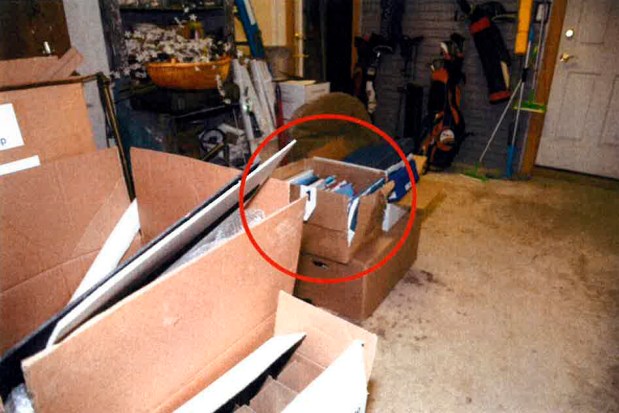 This image, contained in the report from special counsel Robert Hur, and annotated by source, shows a damaged box where classified documents were found in the garage of President Joe Biden in Wilmington, Del., during a search by the FBI on Dec. 21, 2022. (Justice Department via AP)